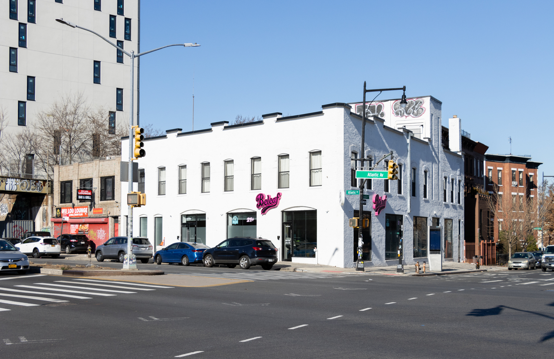 1077 atlantic avenue at franklin - brick building painted white with signage for Beleaf, a cannabis business